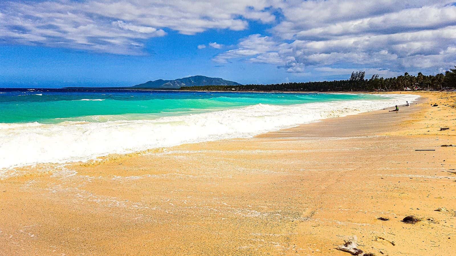 Long sandy shore of Dahican Beach, Mati