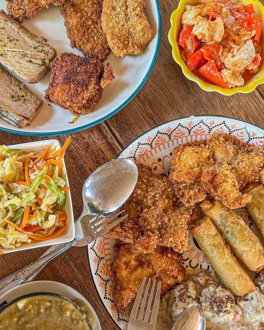 Fried chicken, slaw and rice on a patterned plate