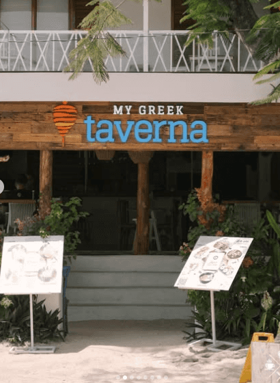 My Greek Taverna sign above a wooden entrance
