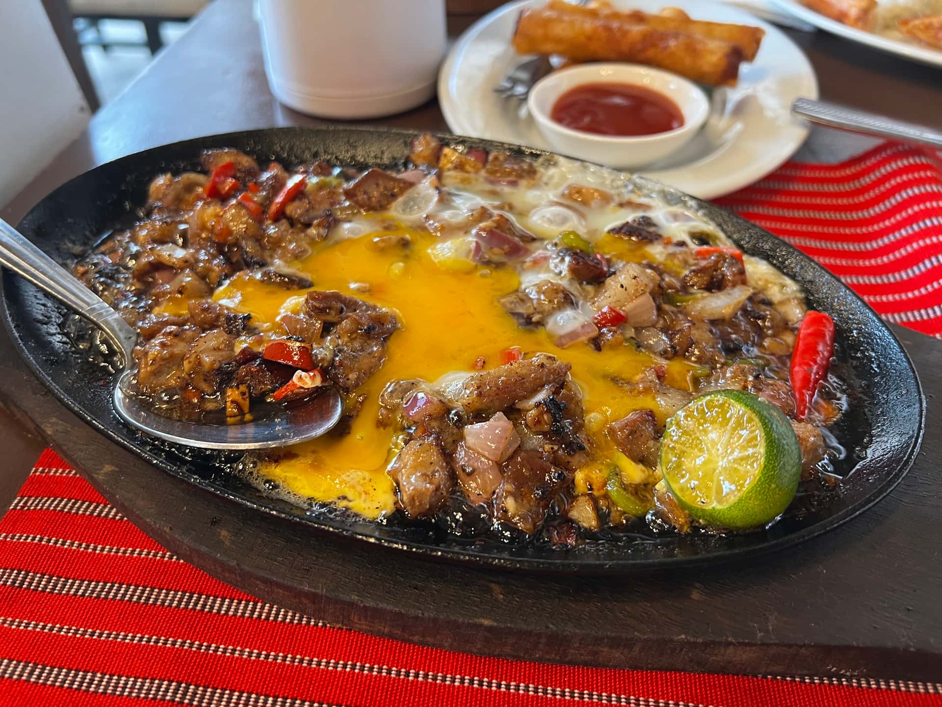 Sizzling pork sisig with egg at Hapag, General Luna