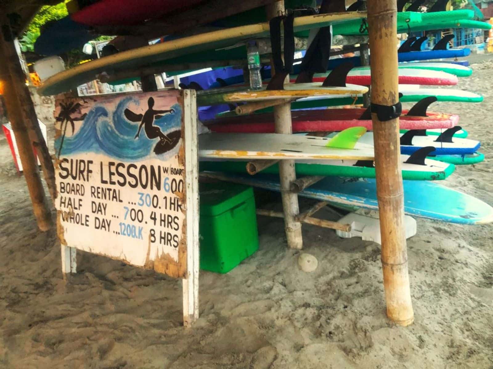 Surf lesson sign and rental boards on the beach at Urbiztondo, San Juan, La Union