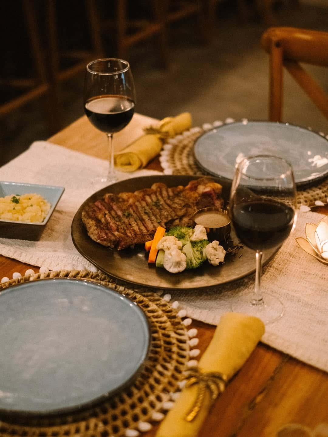 Angus steak with red wine on a set table