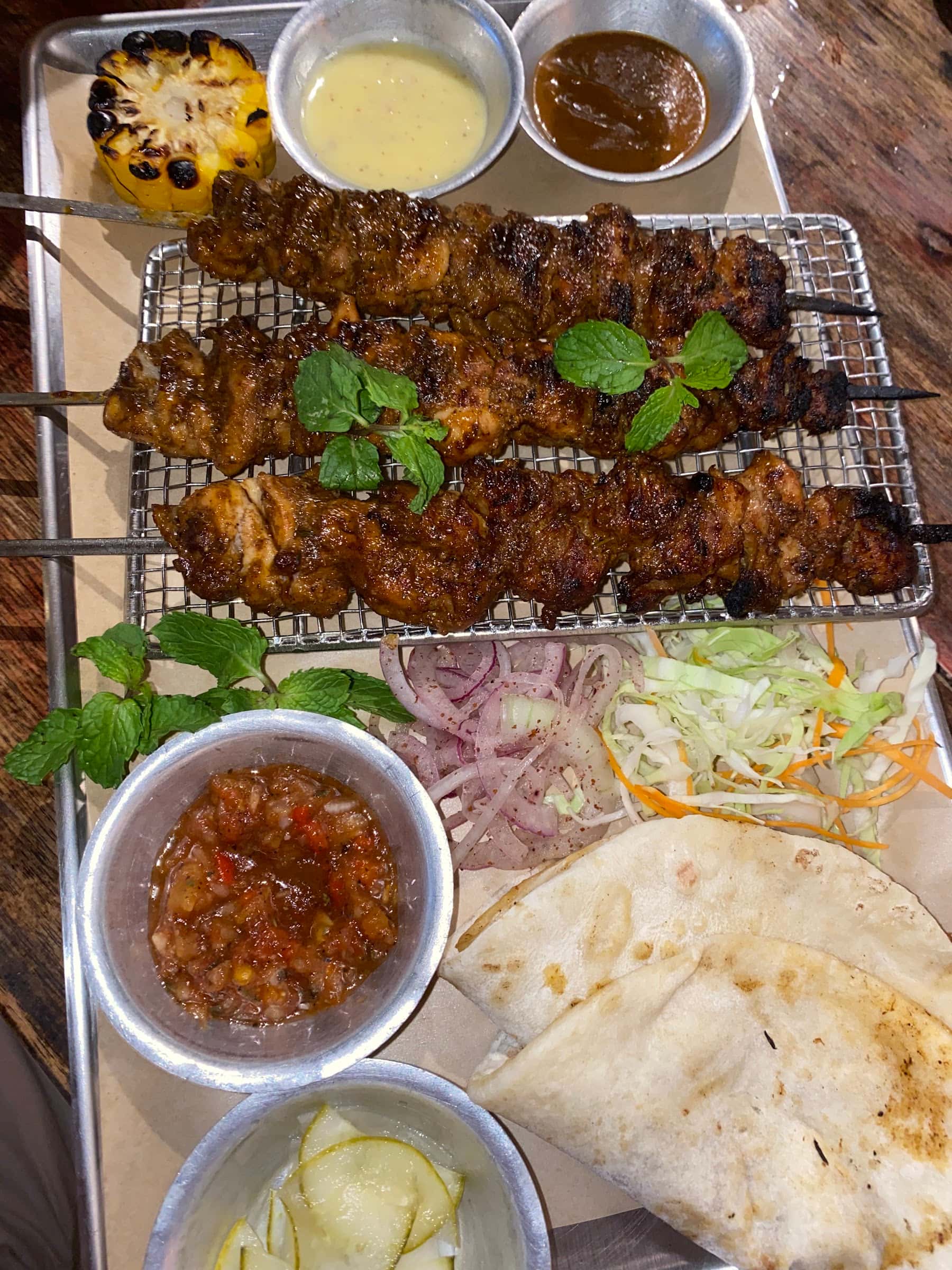 Kebab skewers with flatbread and dips at Meze Grill, General Luna