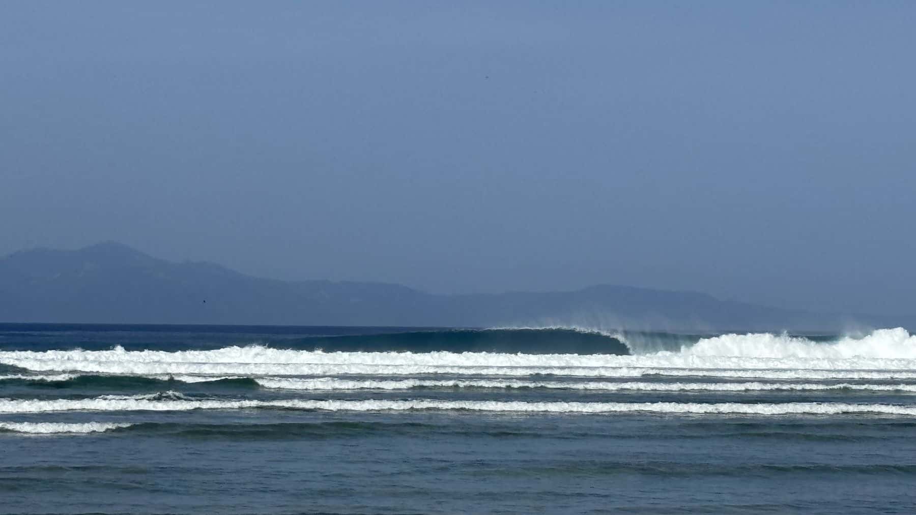 A long right peeling at Punta Right with the hills behind