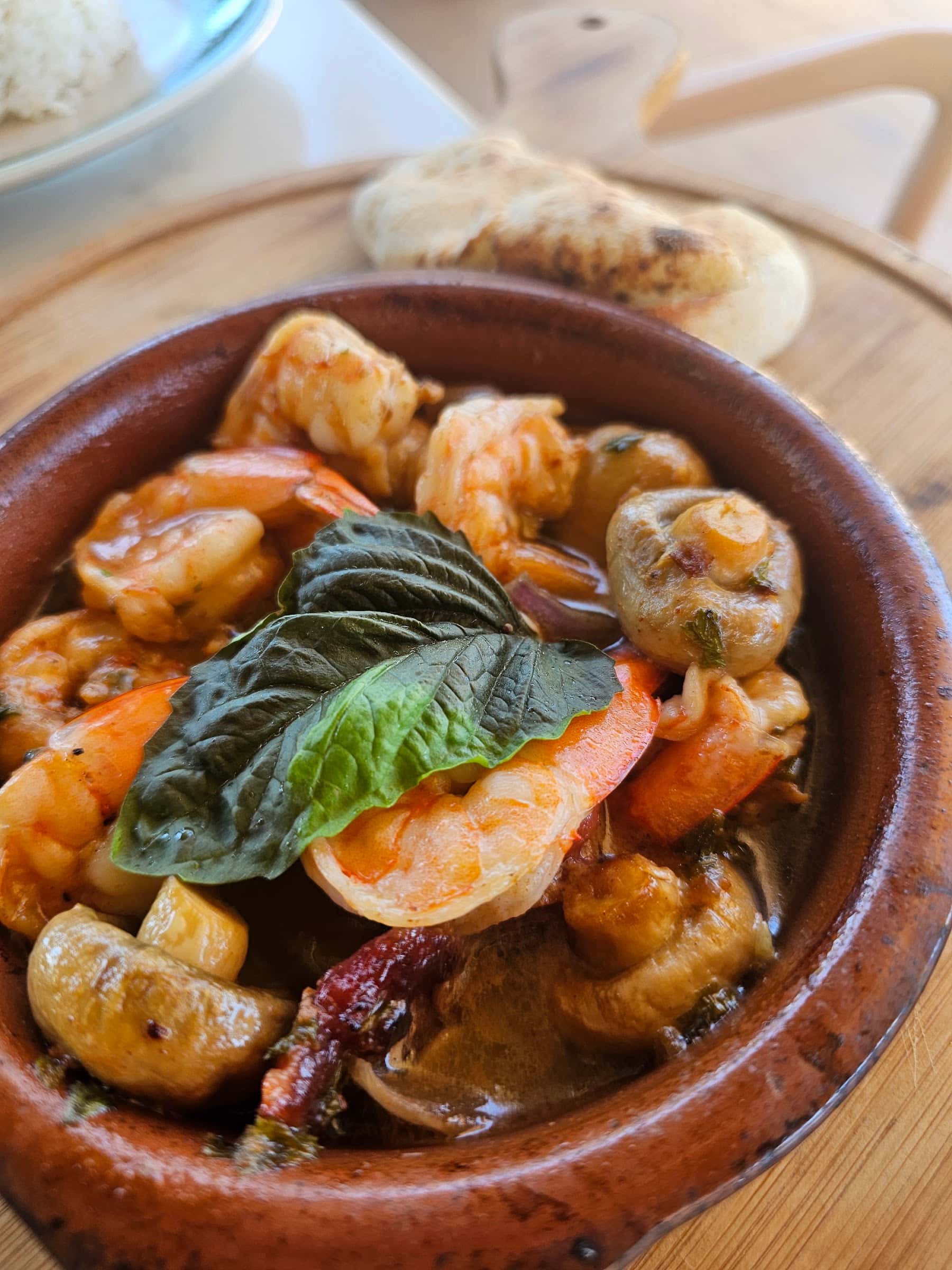 Garlic shrimp in a clay pot at S.A.L.T., Reside Siargao, General Luna
