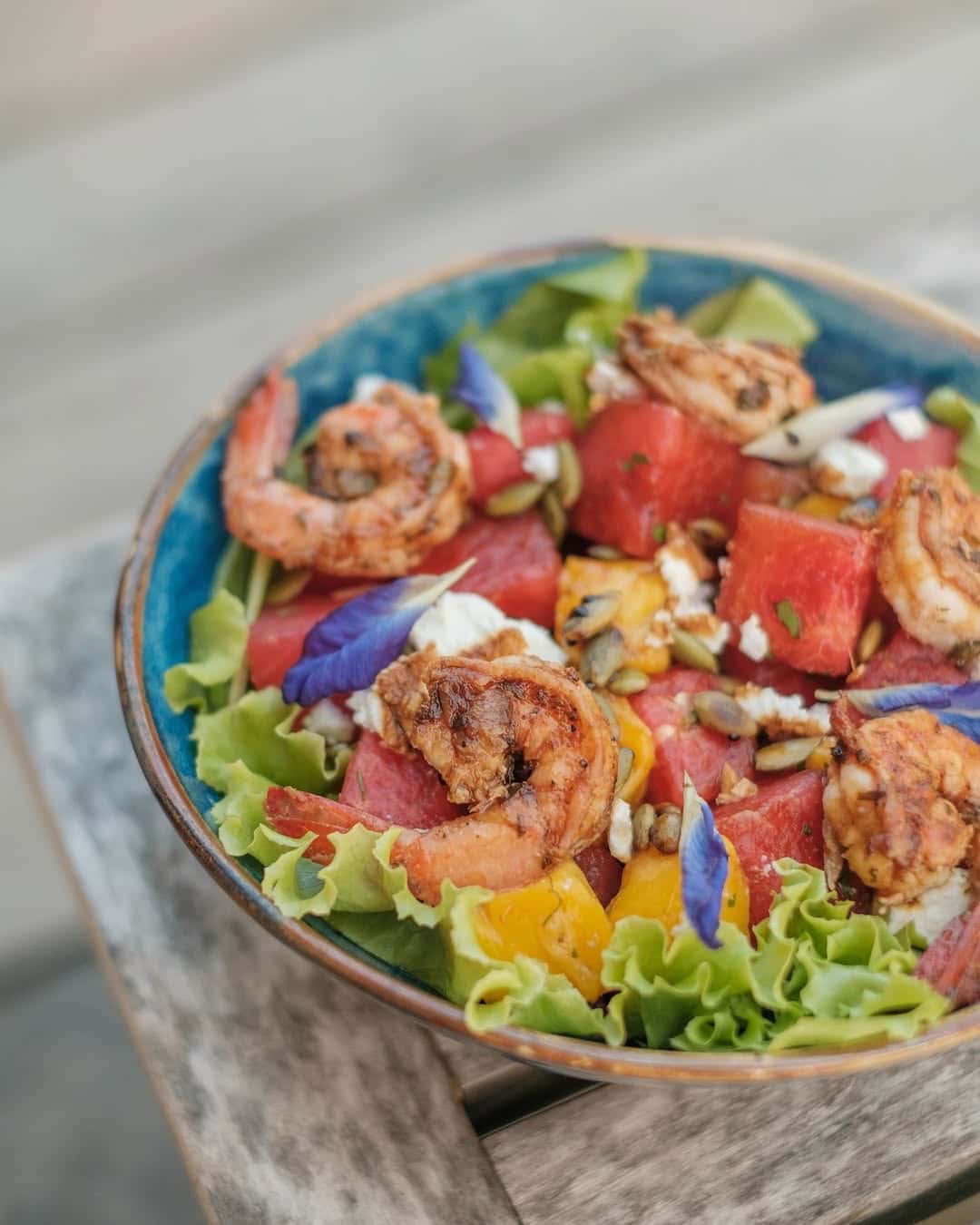 Prawn and watermelon salad in a patterned bowl