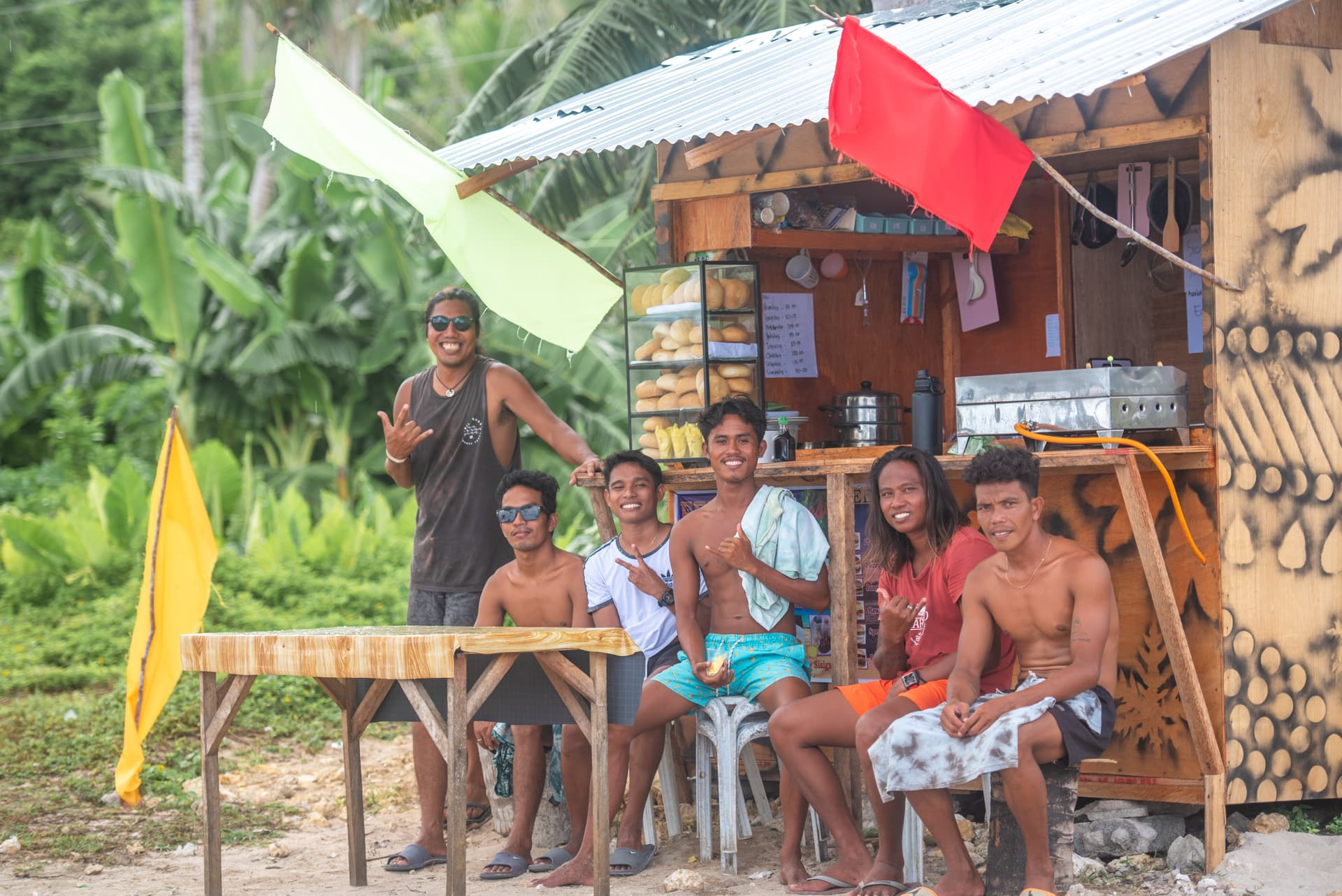 Locals smiling at Pacifico in Siargao