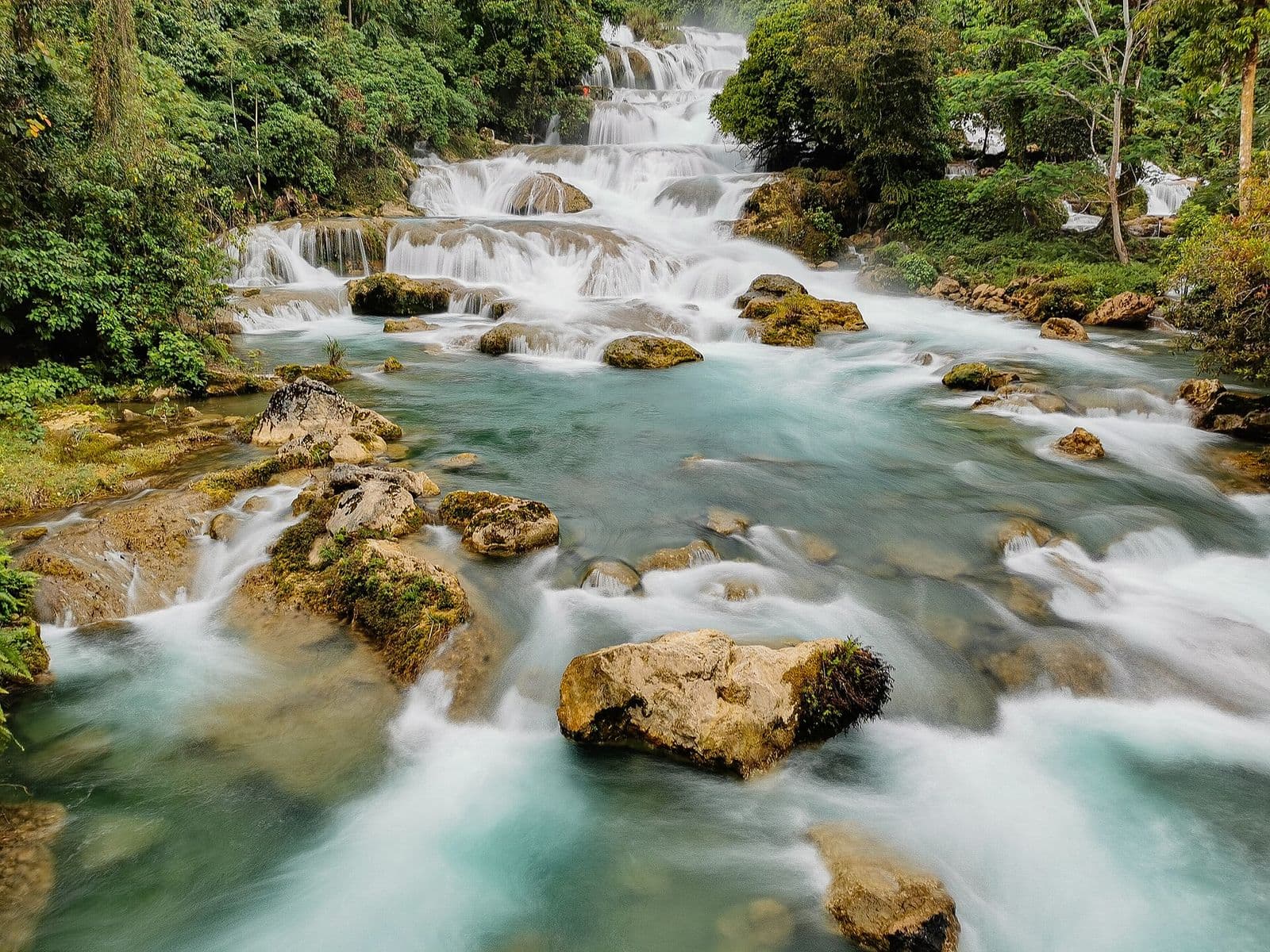 Water flowing over rocks below Aliwagwag Falls