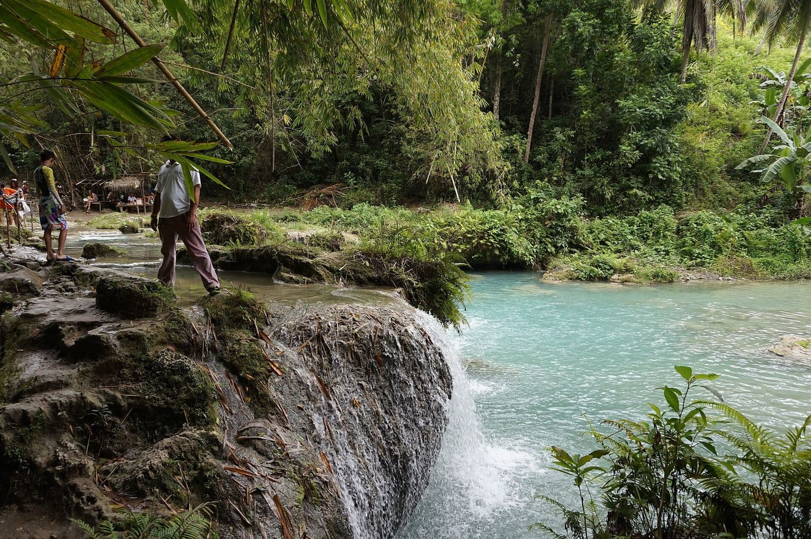 Walking across the lower tiers of Cambugahay Falls