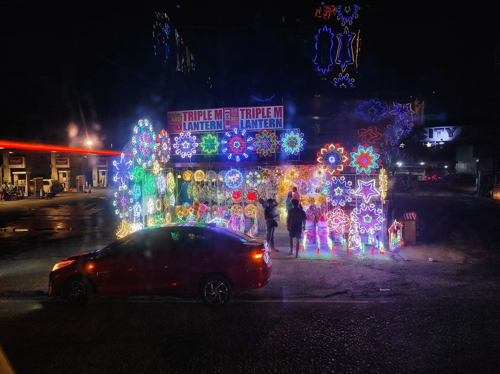 Christmas lanterns strung up along a Philippine street