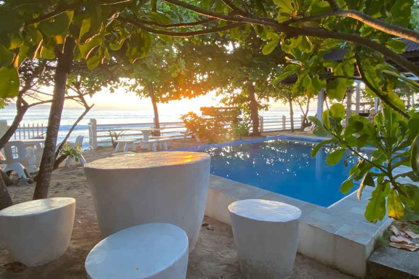 A beachfront resort pool at Dahican at sunrise