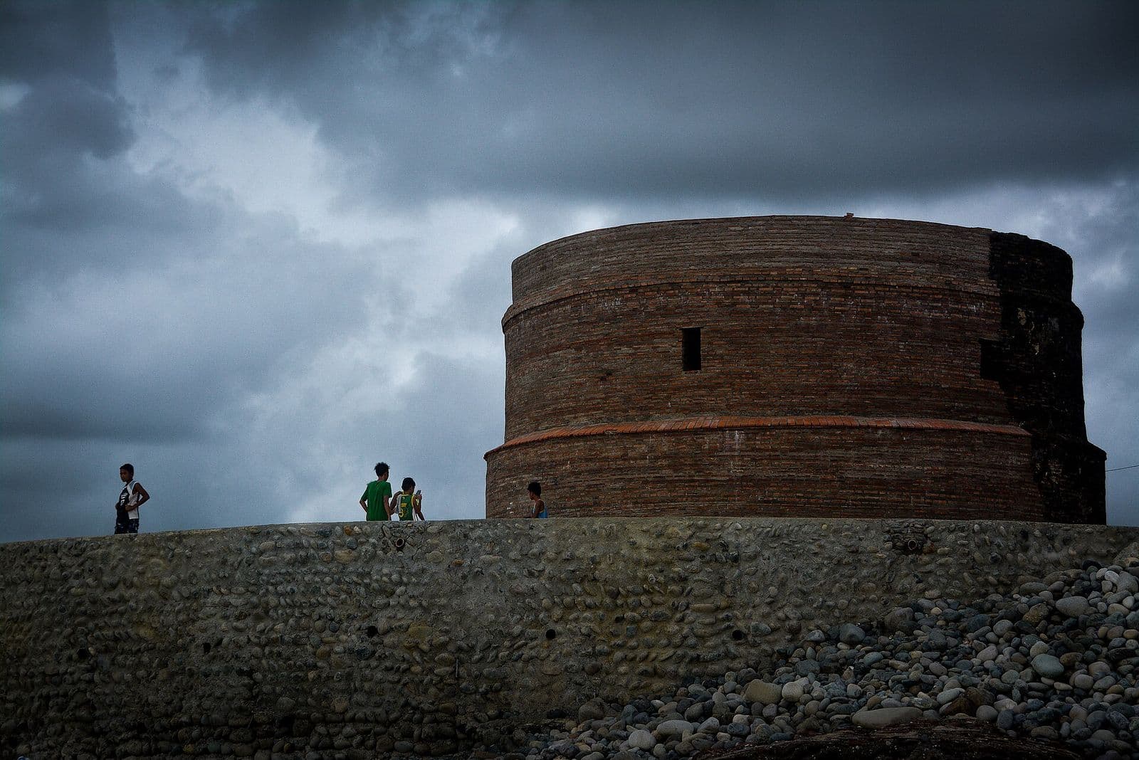The Baluarte watchtower in Luna, La Union, under a stormy sky