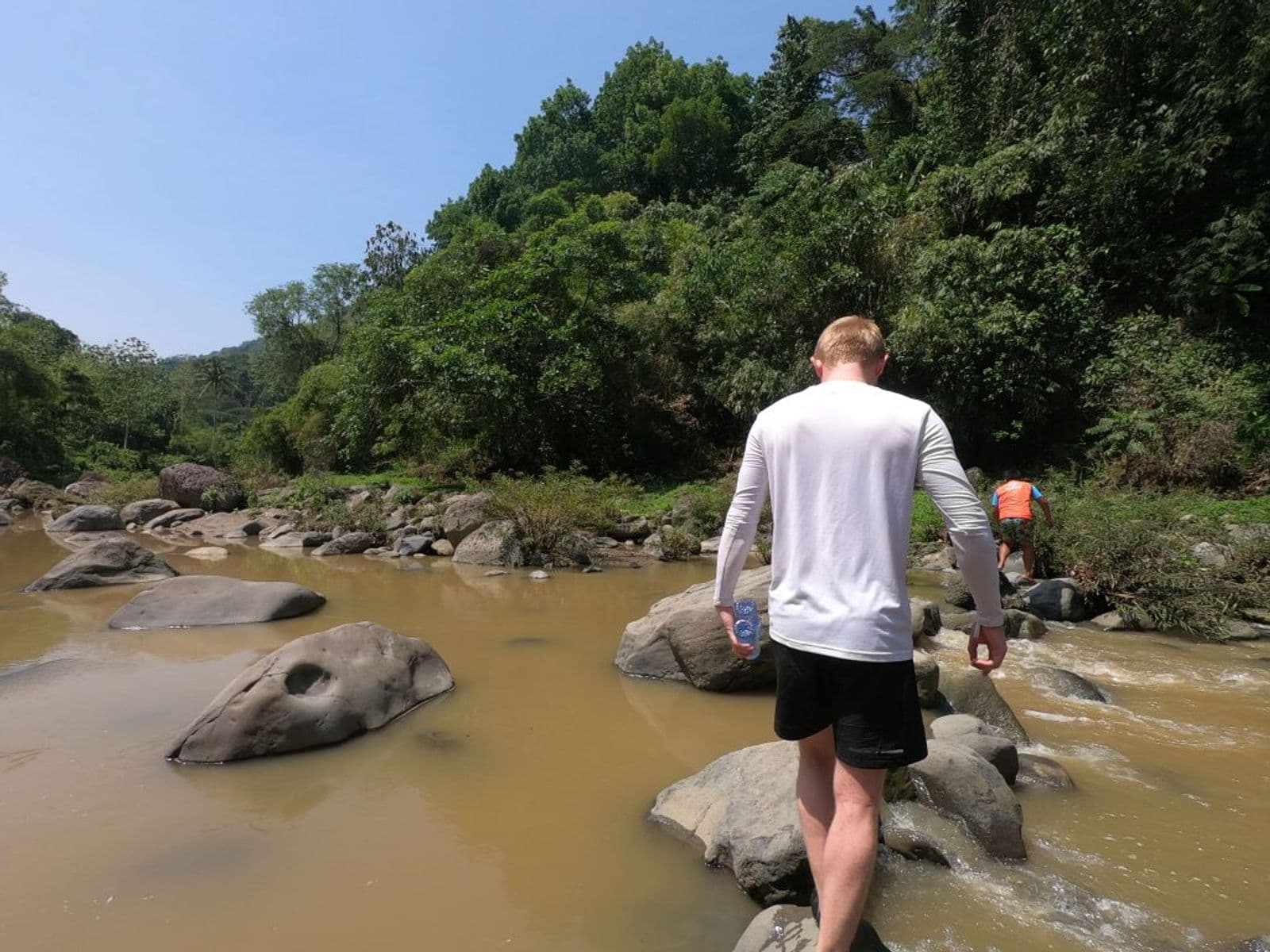 Crossing the river on the trail to Tangadan Falls, La Union