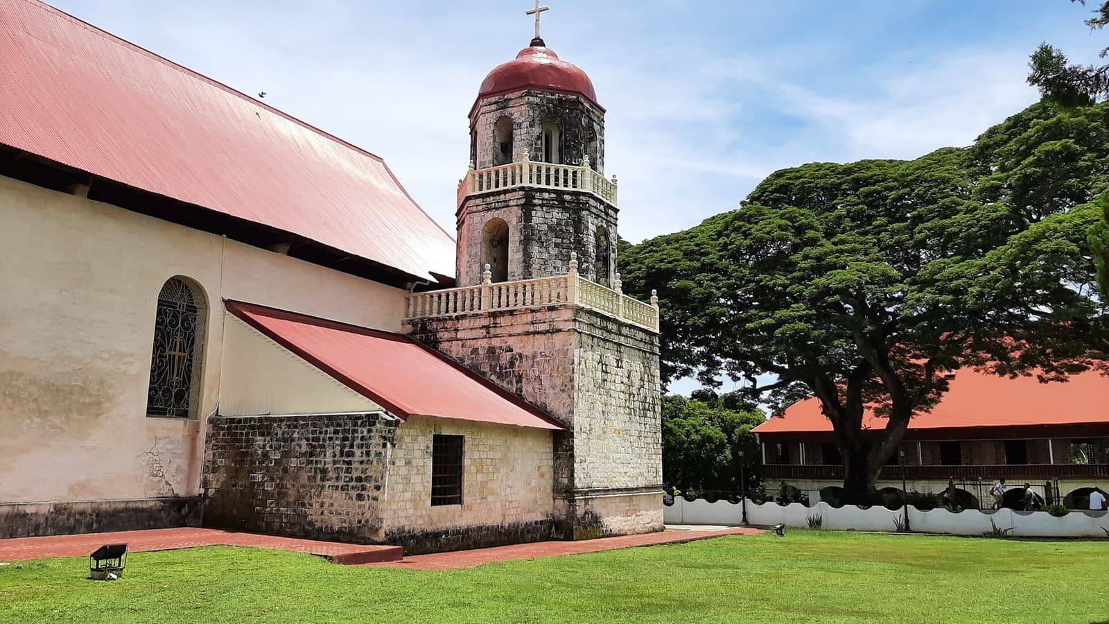 Bell tower and red roof of Lazi Church