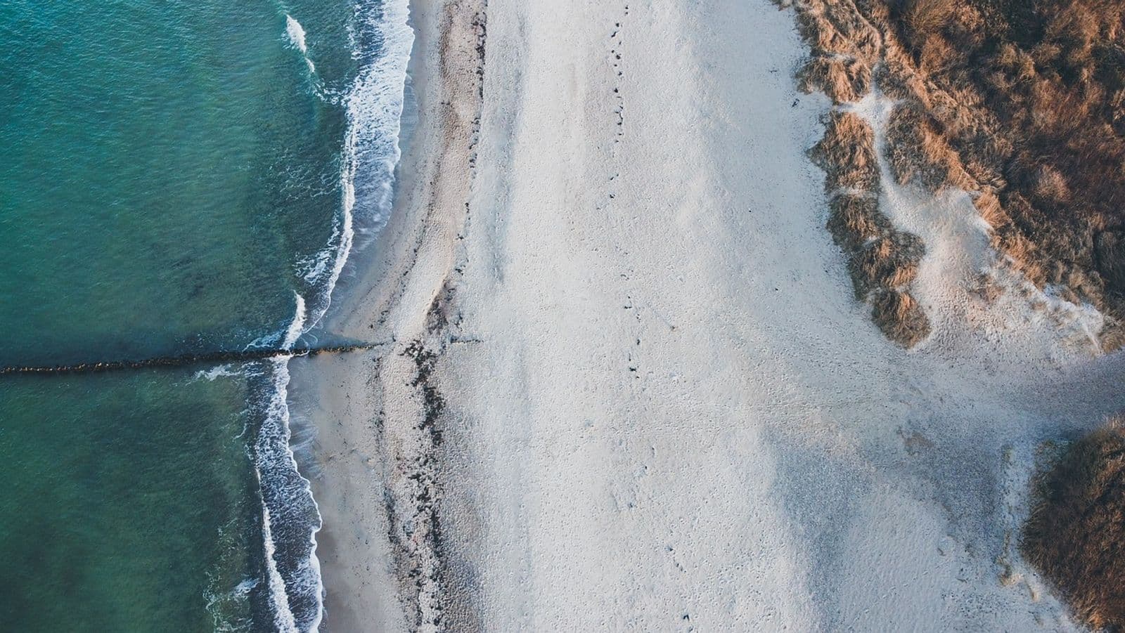 Aerial view of the sand and shallow reef at Paliton Beach