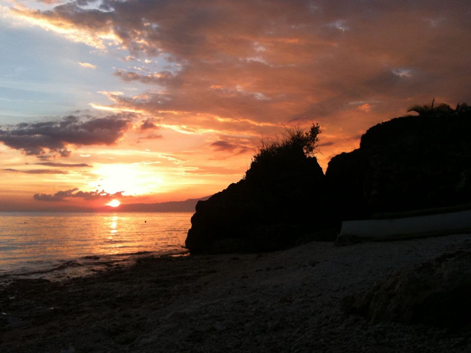 Sunset beside a rocky headland on Siquijor